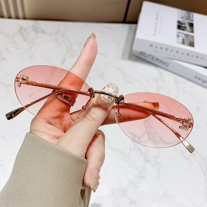 Free shipping designer frameless European American fashion street style trendy retro elegant letter oval sunglasses