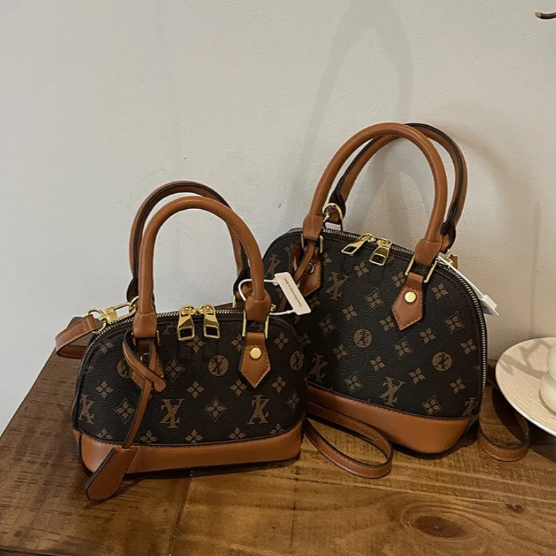 Free shipping Light Fashionable female Advanced printed retro light hand-held vintage flower shell new versatile and temperament crossbody shoulder ba