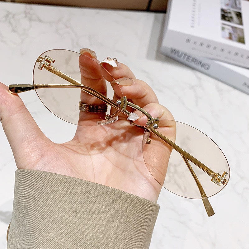 Free shipping designer frameless European American fashion street style trendy retro elegant letter oval sunglasses