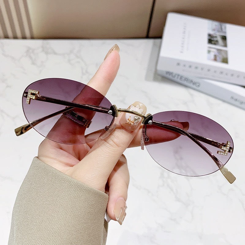 Free shipping designer frameless European American fashion street style trendy retro elegant letter oval sunglasses