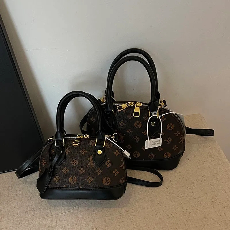 Free shipping Light Fashionable female Advanced printed retro light hand-held vintage flower shell new versatile and temperament crossbody shoulder ba