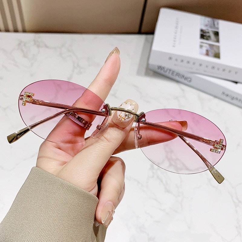 Free shipping designer frameless European American fashion street style trendy retro elegant letter oval sunglasses