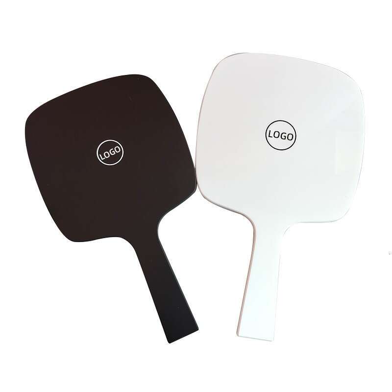 Designer holding black and white classic style women's travel portable small mirror essential makeup