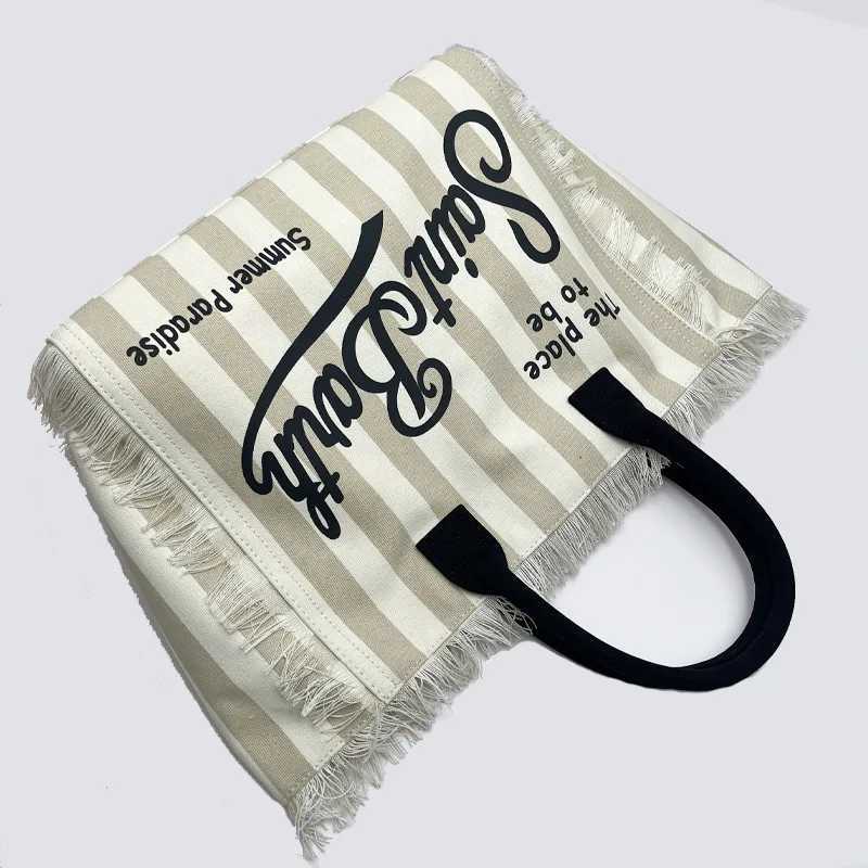 New Womens Large Capacity Casual Beach Canvas Striped Tassel Handbag from Saint Bart Europe and the United StatesW250420