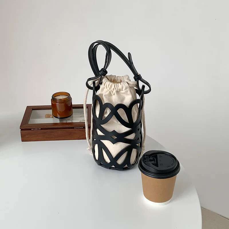 Korean Version Niche Design Cydrical Bucket Canvas Shoulder Women's Crossbody Versatile Pu Hollow Bag
