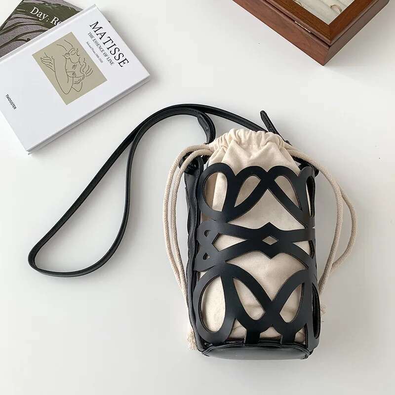 Korean Version Niche Design Cydrical Bucket Canvas Shoulder Women's Crossbody Versatile Pu Hollow Bag