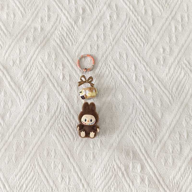 New Mini Labubu Kawaii Particle Bow Keychain Creative 3D Doll Bag Phone Charm Keychain Male and Female Gifts M250419