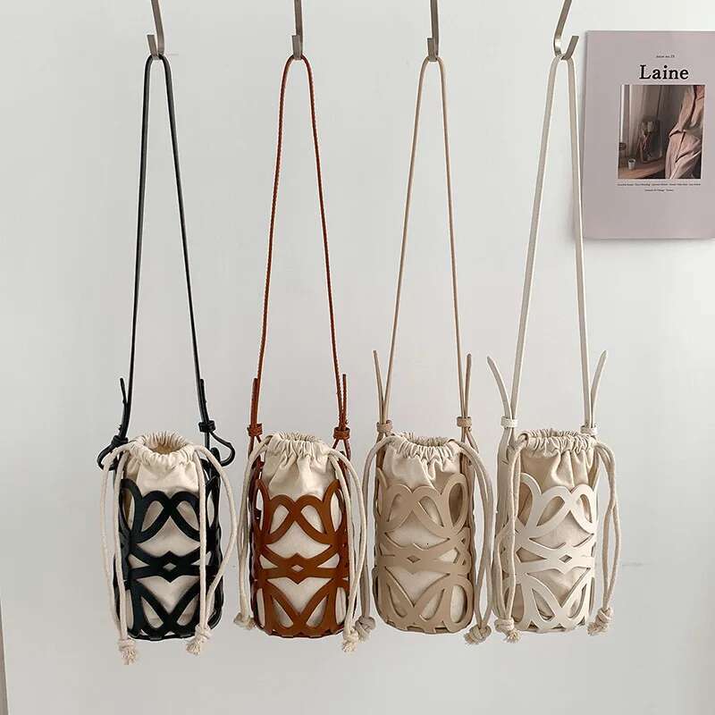 Korean Version Niche Design Cydrical Bucket Canvas Shoulder Women's Crossbody Versatile Pu Hollow Bag