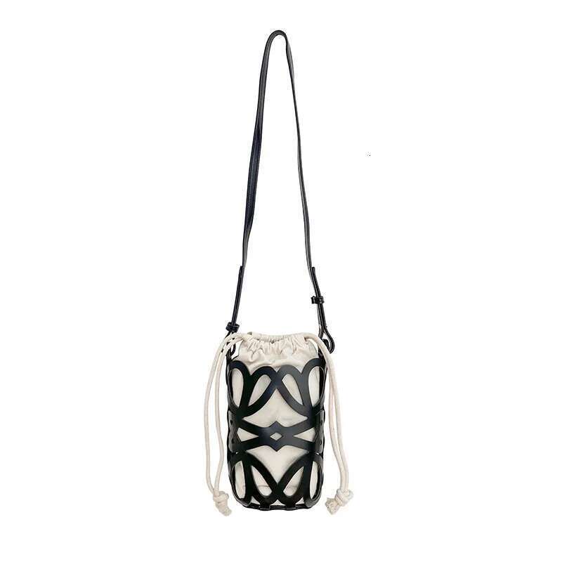 Korean Version Niche Design Cydrical Bucket Canvas Shoulder Women's Crossbody Versatile Pu Hollow Bag