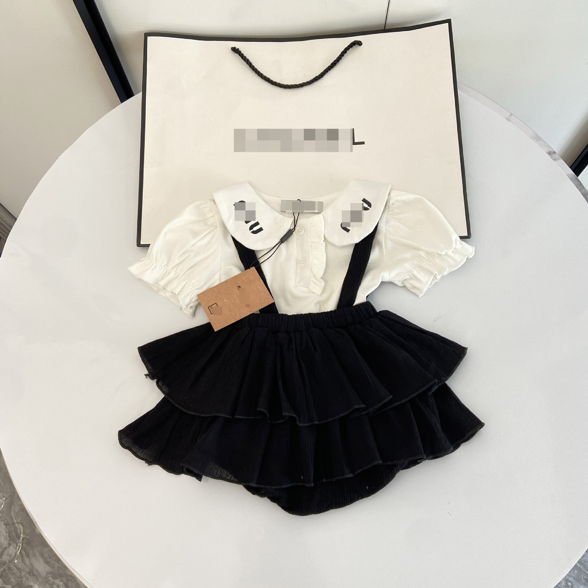 New hot selling designer baby clothes summer Korean style baby girl solid color large lapel shirt suspender bag butt pants skirt two-piece set