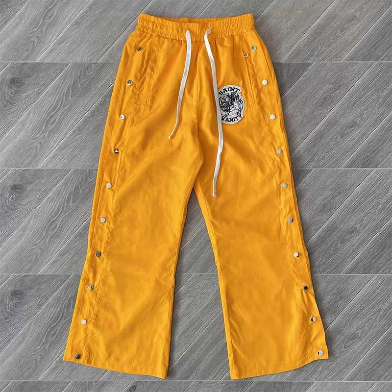 Chic Yellow and Rose Red Tracksuit designed by Saint Vanity features zippered pockets talismans and a positive lifestyle appeal X250421