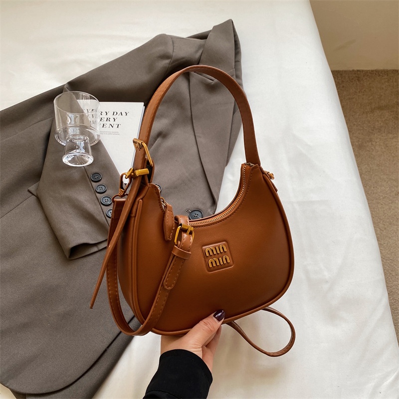 2025 New Free Shipping Hot selling Women's Bag Simple and Versatile Underarm Bag Designer black white color Women's Versatile Fashion Handba
