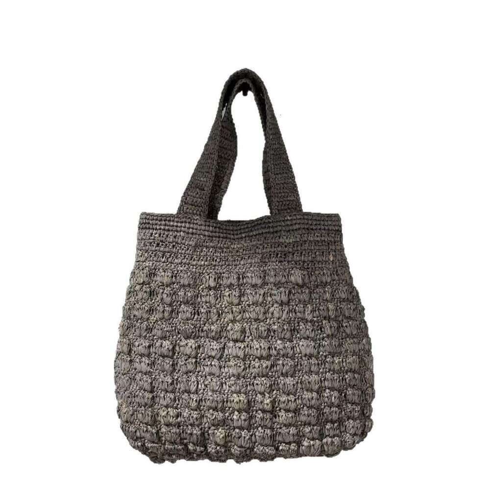 Ins Style Resort Beach Bag Lafite Solid Color Hollow Grass Handbag New Small Design Handmade Woven Beach Vacation Bag KQ