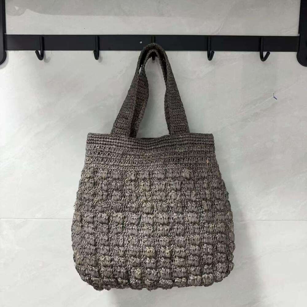 Ins Style Resort Beach Bag Lafite Solid Color Hollow Grass Handbag New Small Design Handmade Woven Beach Vacation Bag KQ
