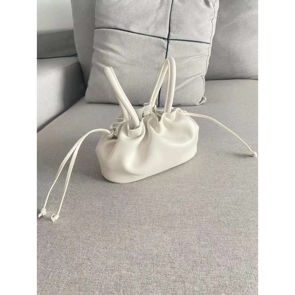 2025 New Mini Wrinkle Texture Handheld Women's With Genuine Leather Streamed Leisure One Shoulder Oblique Straddle Bag Designer's bag Design