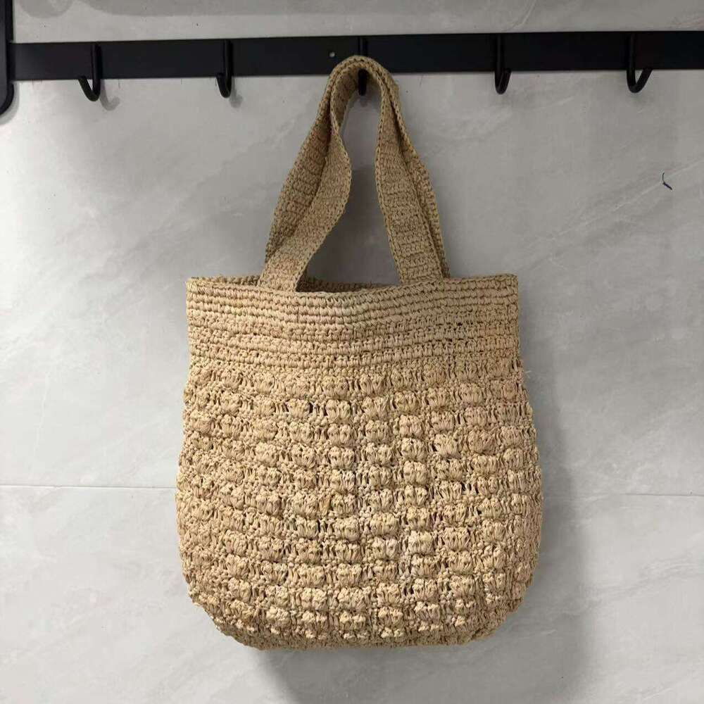 Ins Style Resort Beach Bag Lafite Solid Color Hollow Grass Handbag New Small Design Handmade Woven Beach Vacation Bag KQ
