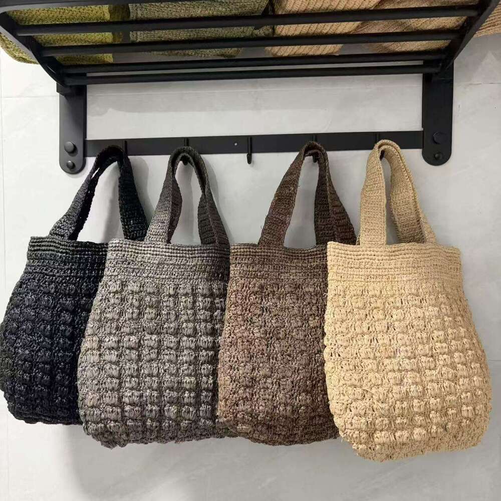Ins Style Resort Beach Bag Lafite Solid Color Hollow Grass Handbag New Small Design Handmade Woven Beach Vacation Bag KQ
