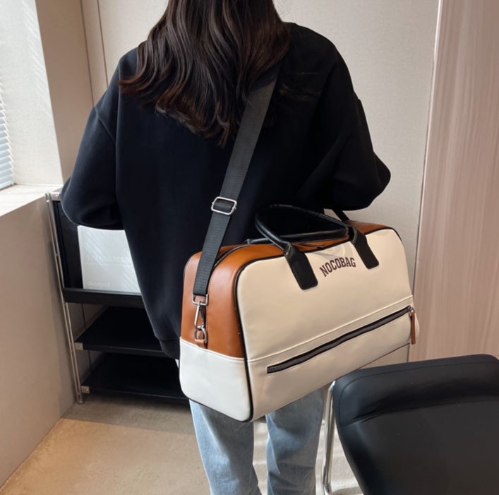 Luggage bag Large capacity men and women lightweight short trip handbag Letters decorated American style leather bag Simple design business boarding l