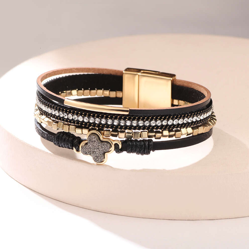 The new Bohemian four leaf clover studded dia multi-layer leather magnetic buckle is exquisite, fashionable, and high-end bracelet