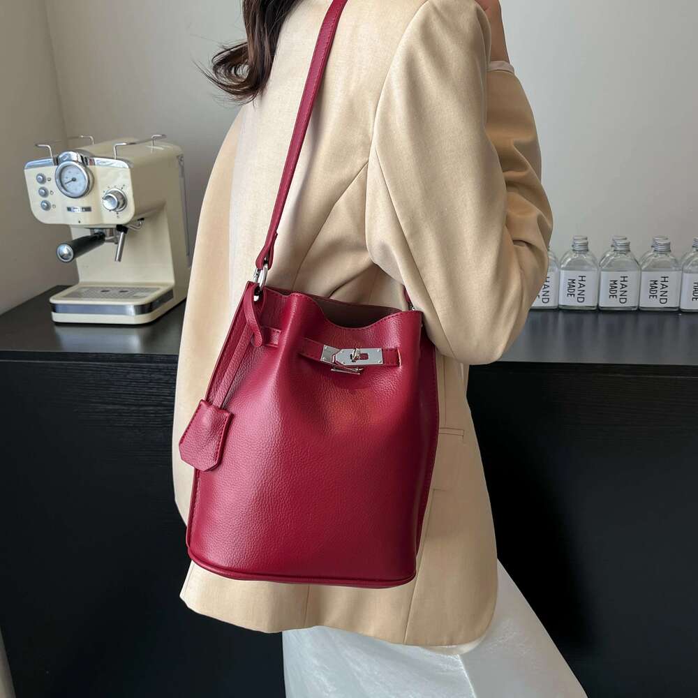 Simple Bucket Bag For Women's Daily Outings. A High - Quality Leather Bucket Bag In A Deep Brown Color, Exquisitely Adorned With
