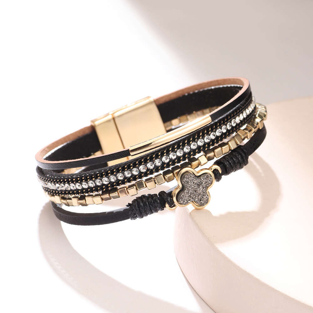 The new Bohemian four leaf clover studded dia multi-layer leather magnetic buckle is exquisite, fashionable, and high-end bracelet
