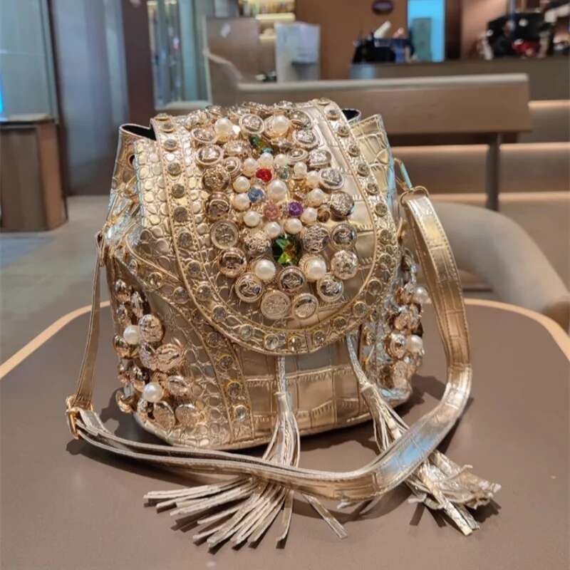 Spring new PU large-capacity pearl rhinestone rivet cross-body backpack casual tassel chain one-shoulder underarm women's bag