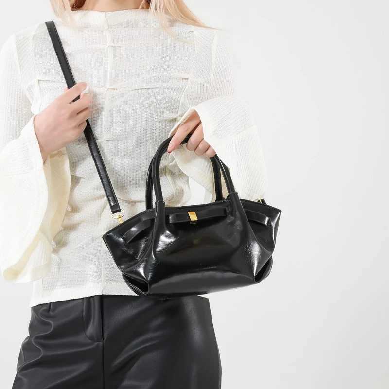 High end retro cross shaped bag suitable for women - fashionable leather messenger Parisian designer minimalist style solid color W250425
