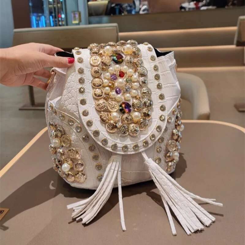 Spring new PU large-capacity pearl rhinestone rivet cross-body backpack casual tassel chain one-shoulder underarm women's bag