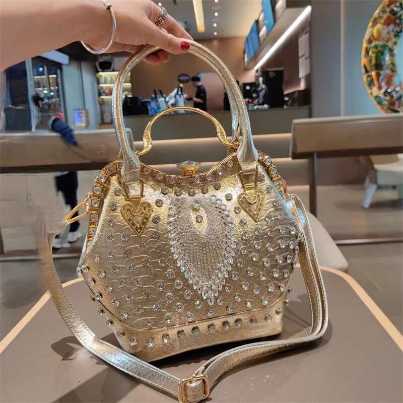 Spring new rivet crystal vertical large-capacity metal buckle handbag banquet dress versatile one-shoulder cross-body women bag