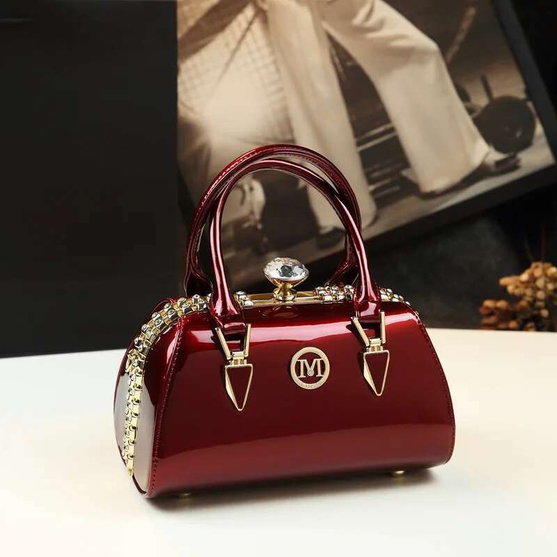 Spring new patent leather rhinestone buckle clip one-shoulder cross-body banquet dress daily pillow-shaped women's bag