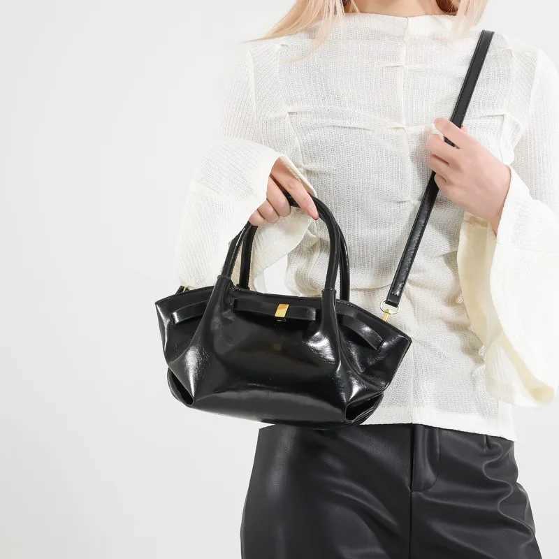 High end retro cross shaped bag suitable for women - fashionable leather messenger Parisian designer minimalist style solid color W250425