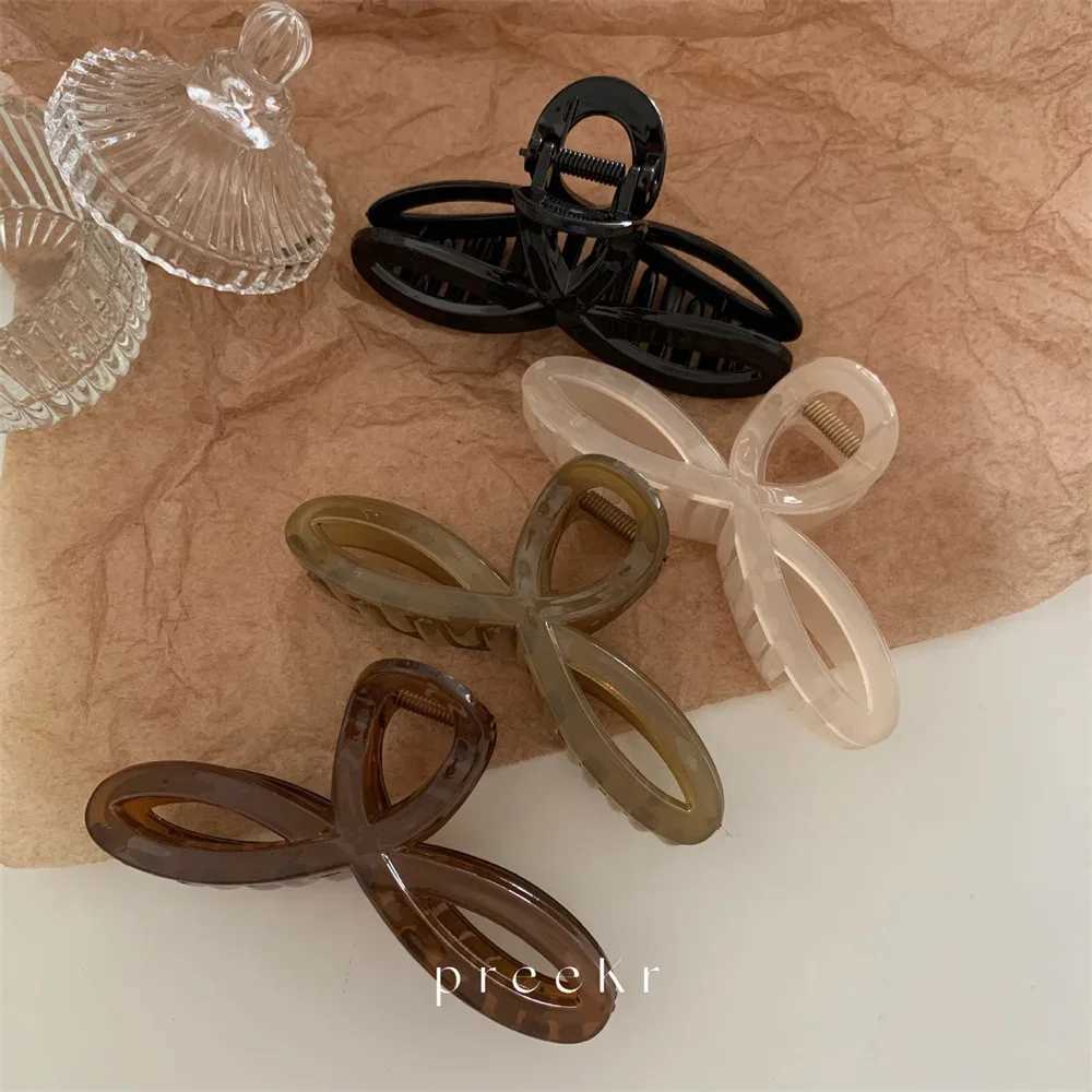 Elegant bow shark clip fashionable back of the head hair clip retro ponytail fixed female hair clip simple hollow geometric hair clipT250425
