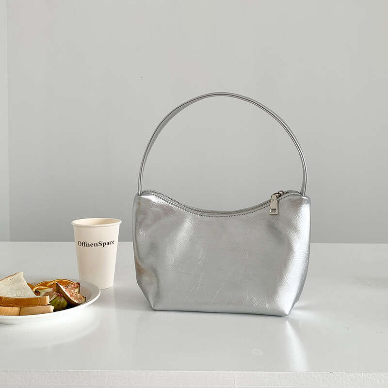 Korean sier commuting style armpit women's simple fashionable handbag, high-end sense, niche and one shoulder dumpling bag, 2025 temperament vers
