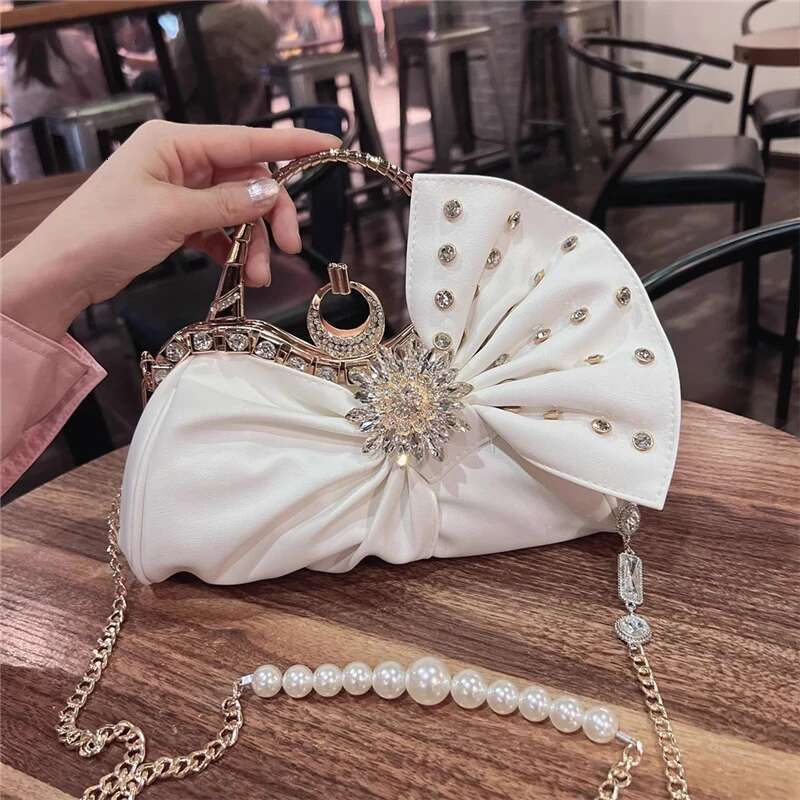 Spring and summer new rhinestone rivet wrinkled bow pearl handbag banquet dress one-shoulder cross-body chain women's bag