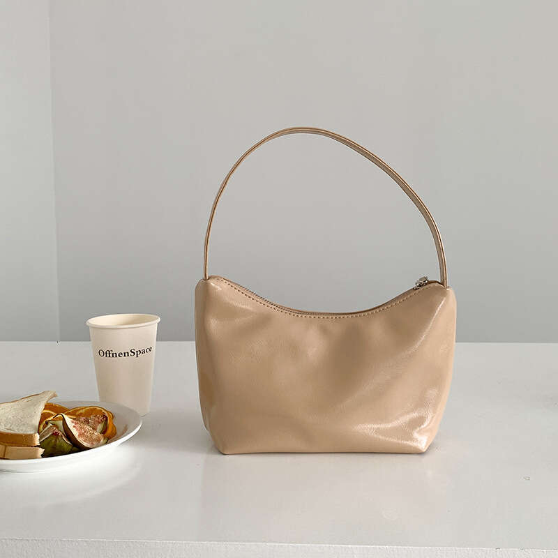 Korean sier commuting style armpit women's simple fashionable handbag, high-end sense, niche and one shoulder dumpling bag, 2025 temperament vers
