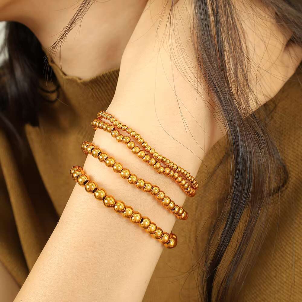 DHCollections JEWELRY SL60 Hot Sale Bean Beaded Hundred Titanium Steel Plated Gold Round Beads Stretch Bracelet
