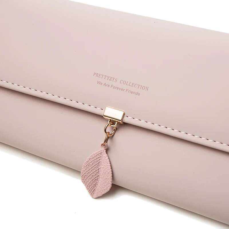 Hot Selling Spring Summer New Women's PU Leather Japanese And South Korea Small Fresh Leaf Pendant Three Fold Bag Large Capa