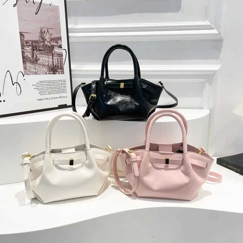 High end retro cross shaped bag suitable for women - fashionable leather messenger Parisian designer minimalist style solid color W250425