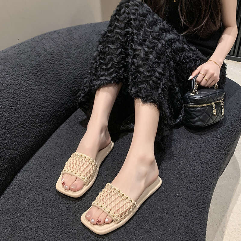 Trendy brand niche high-end cool summer outdoor wear, new temperament, flat bottomed woven beach slippers for women