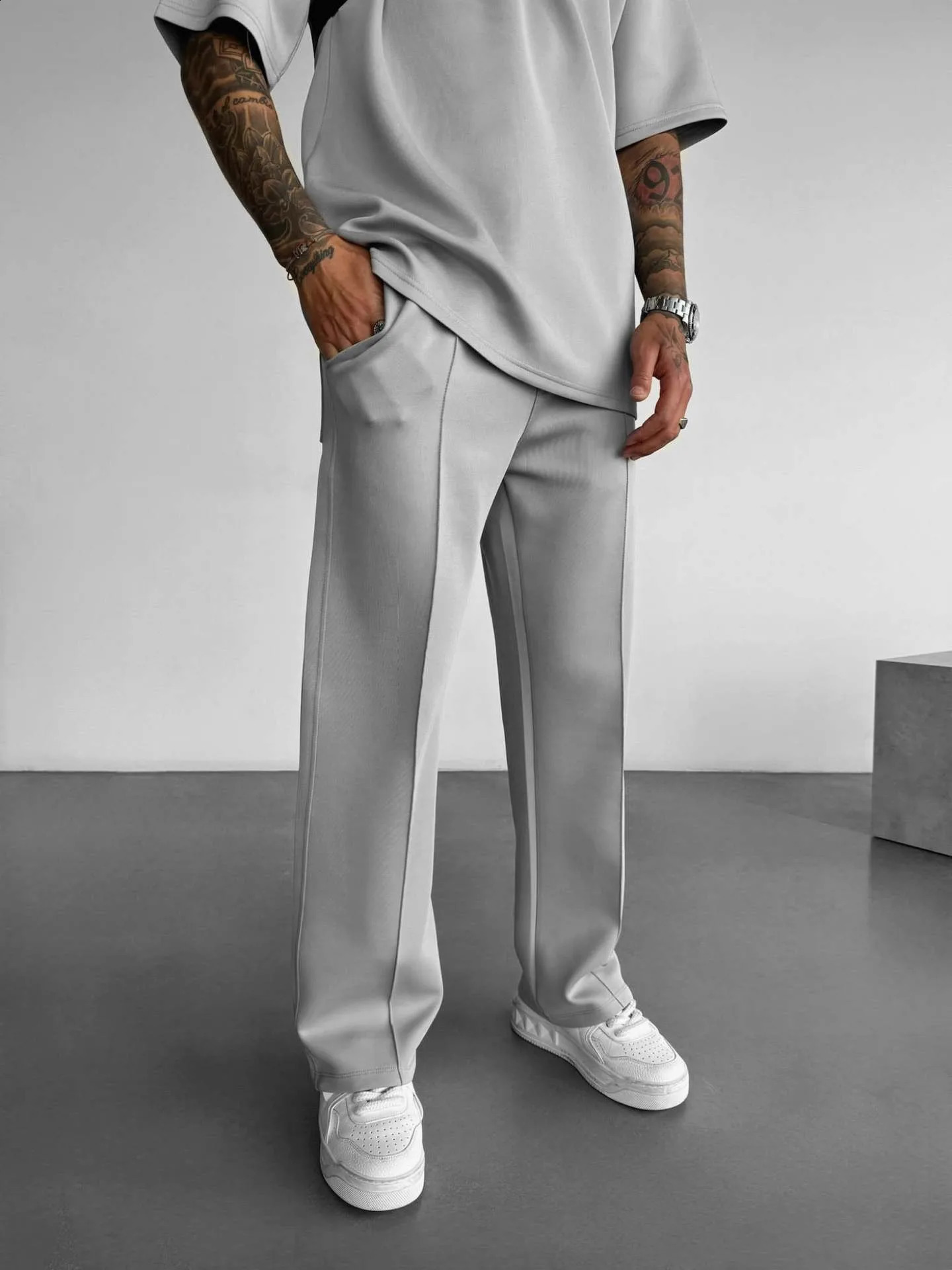 Mens casual pants fashionable and comfortable elastic waist brushed single line pleated solid color pocket mop pants 250422