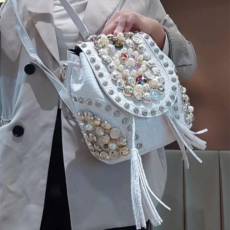 Spring new PU large-capacity pearl rhinestone rivet cross-body backpack casual tassel chain one-shoulder underarm women's bag