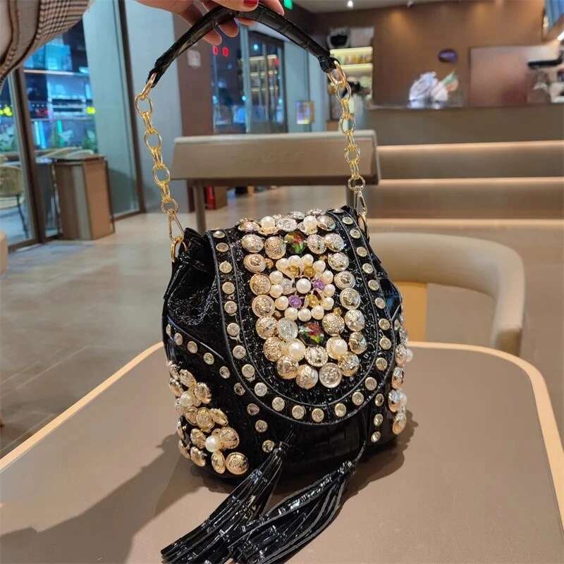 Spring new PU large-capacity pearl rhinestone rivet cross-body backpack casual tassel chain one-shoulder underarm women's bag