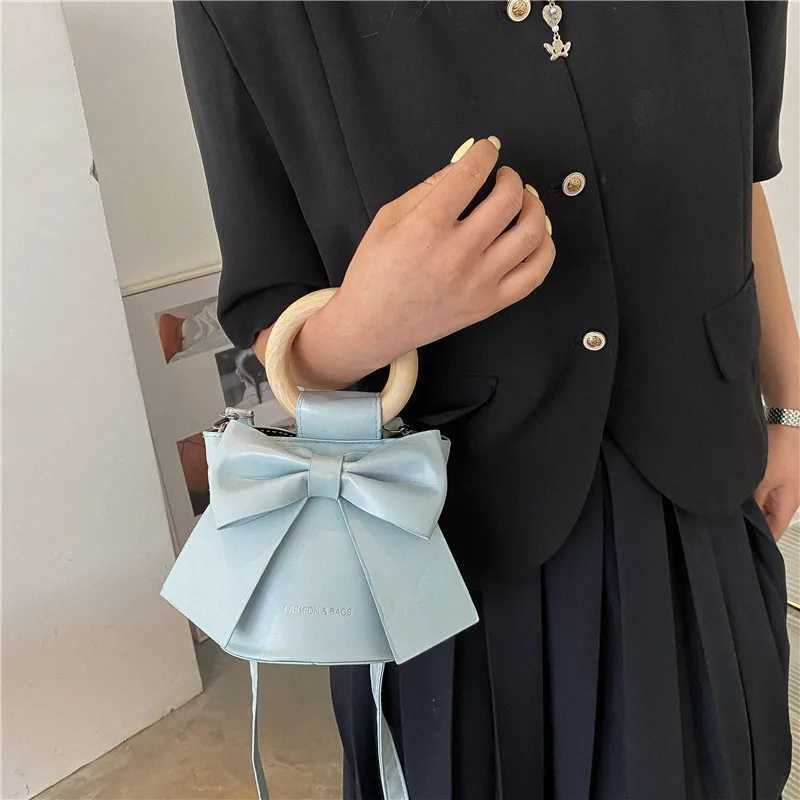 Sweet Bow Tie Designer Mini Shoulder Circumcision Leather Bucket Cross Body Bag Womens Fashion Luxury Brand Handbag Womens Handbag W250421