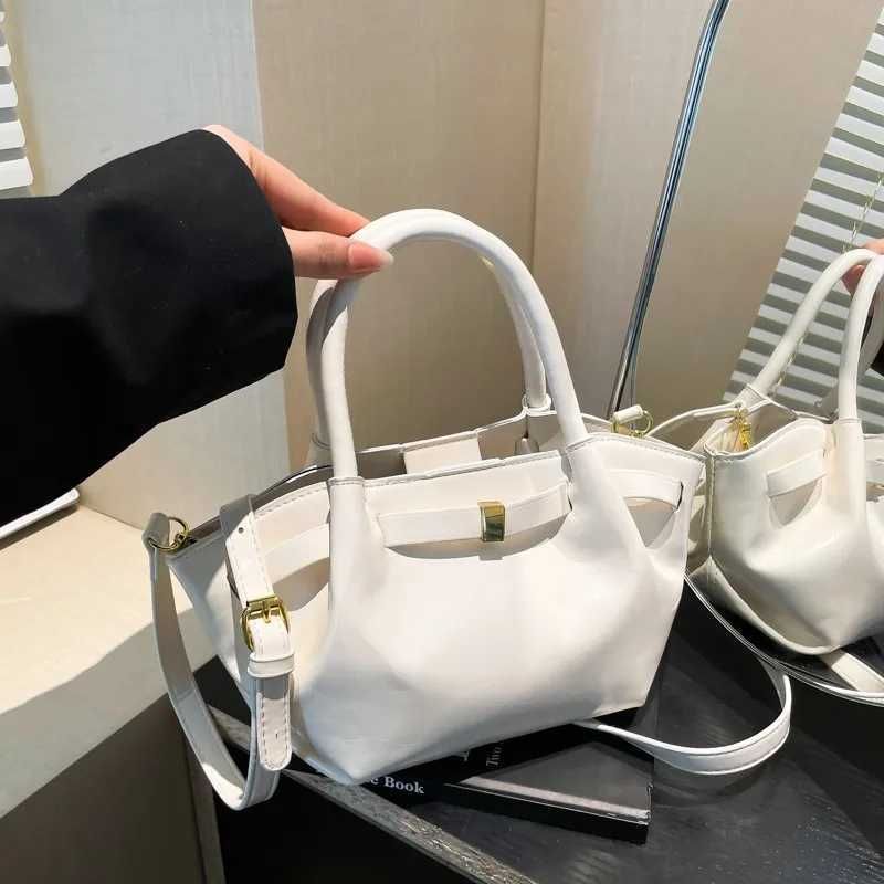 High end retro cross shaped bag suitable for women - fashionable leather messenger Parisian designer minimalist style solid color W250425