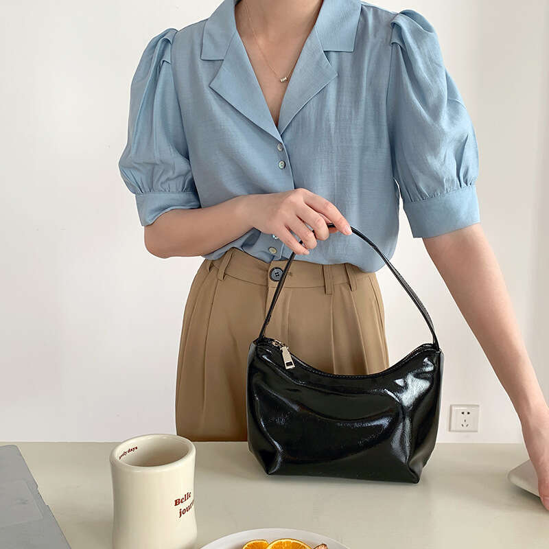 Korean sier commuting style armpit women's simple fashionable handbag, high-end sense, niche and one shoulder dumpling bag, 2025 temperament vers