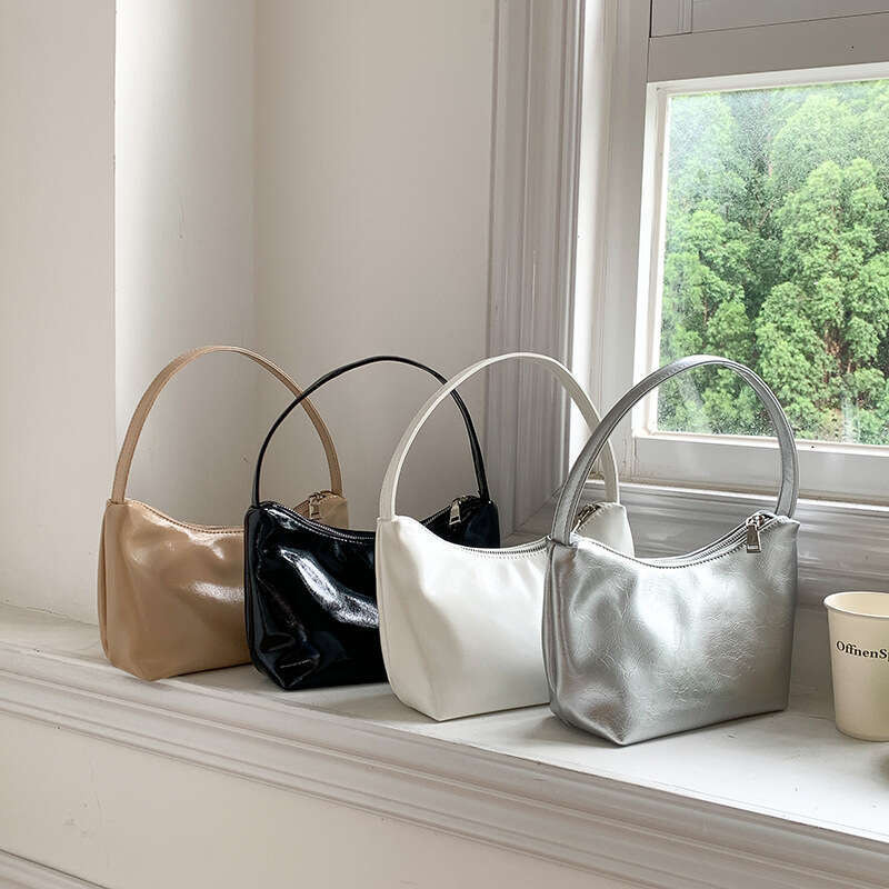 Korean sier commuting style armpit women's simple fashionable handbag, high-end sense, niche and one shoulder dumpling bag, 2025 temperament vers