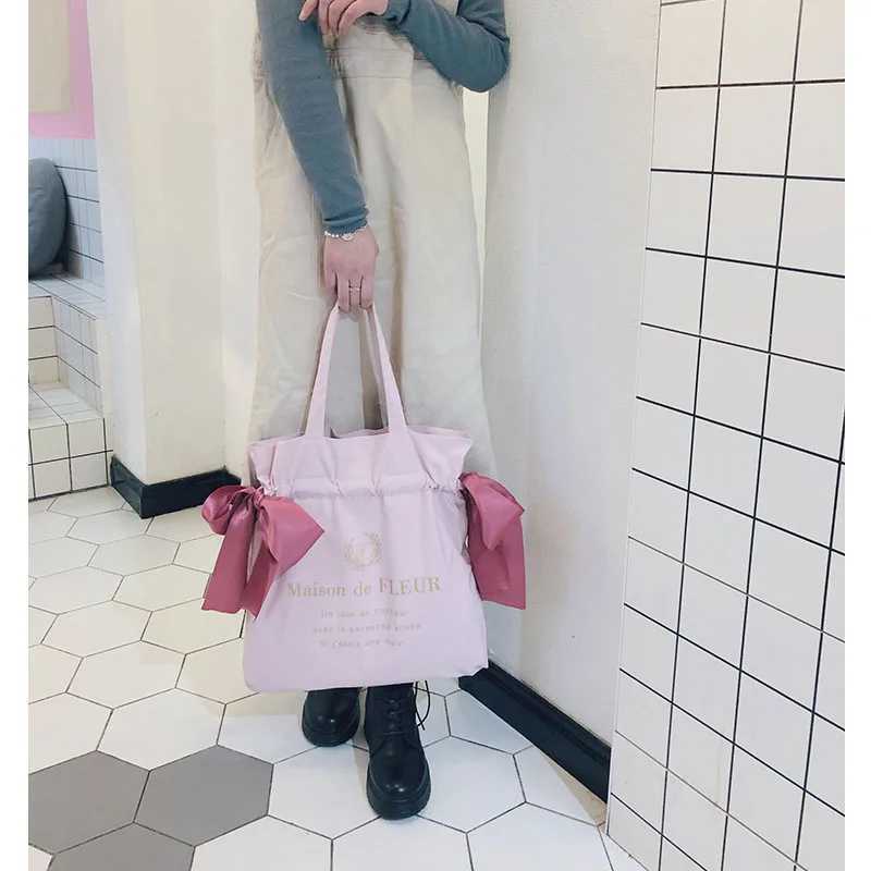 Womens canvas shoulder bag Korean version cute girl bow handbag student fashion large capacity reusable school shopping bag W250421