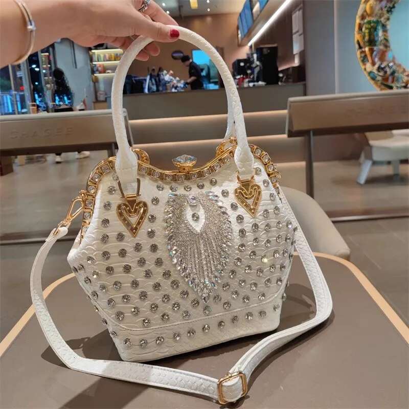 Spring new rivet crystal vertical large-capacity metal buckle handbag banquet dress versatile one-shoulder cross-body women bag