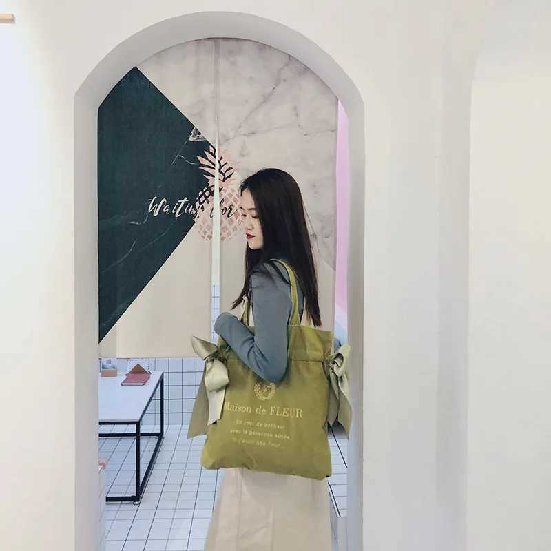 Womens canvas shoulder bag Korean version cute girl bow handbag student fashion large capacity reusable school shopping bag W250421