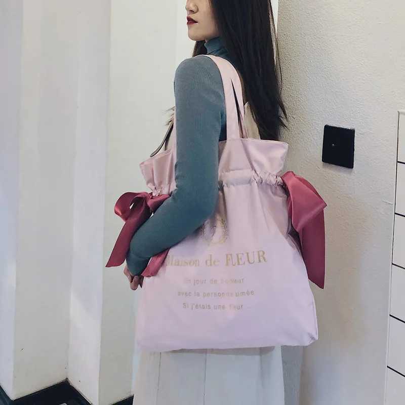 Womens canvas shoulder bag Korean version cute girl bow handbag student fashion large capacity reusable school shopping bag W250421